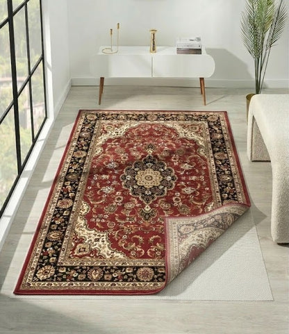 rug-underlay-non-slip.jpg
Close-up of a red traditional rug with a non-slip mesh underlay visible at the corner.